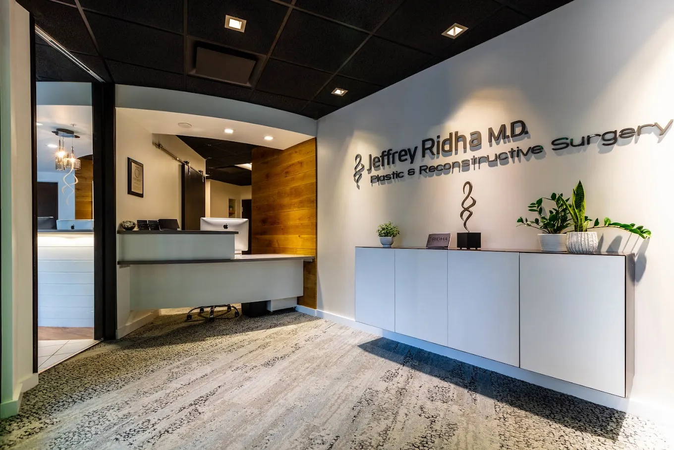 Clean, professional medical spa treatment room with neutral tones at Ridha Plastic Surgery in Saratoga Springs