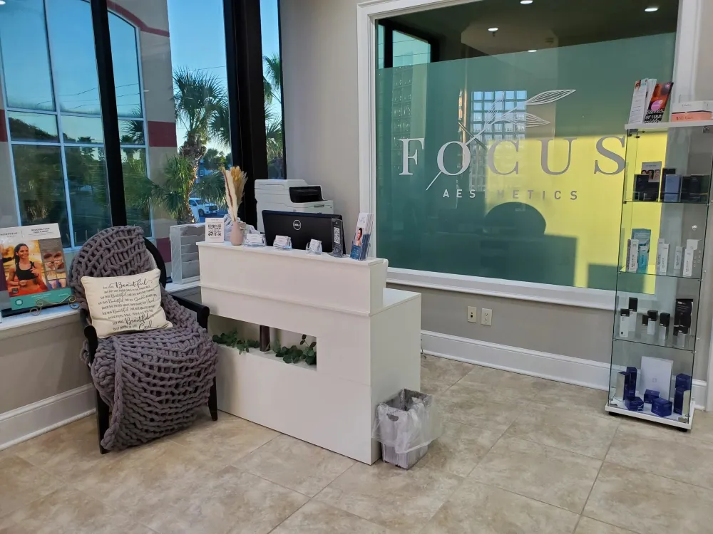 Clean, professional medical spa treatment room with neutral tones at Focus Aesthetics in Neptune Beach