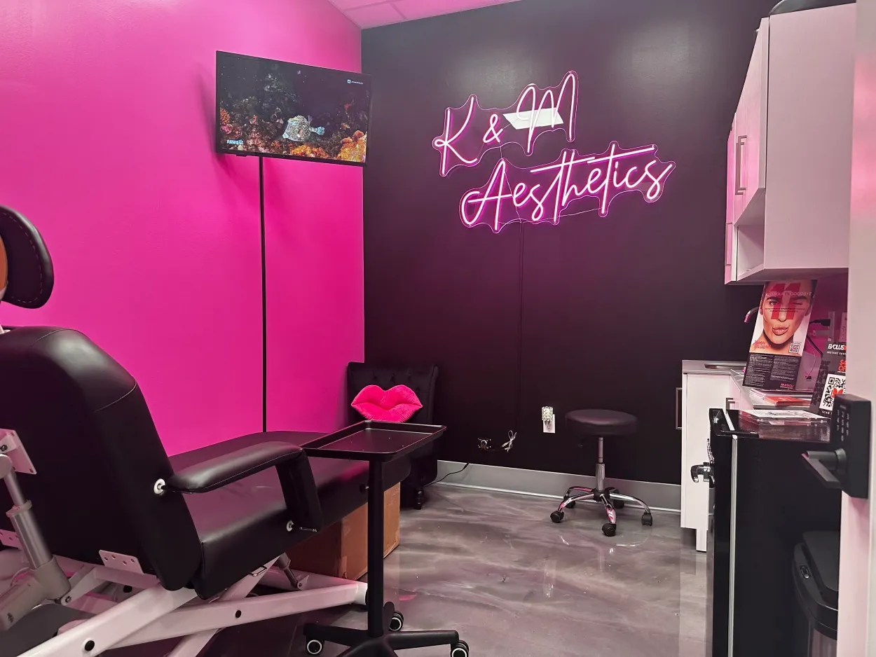 Clean, professional medical spa treatment room with neutral tones at K & M Aesthetics in Cape Coral