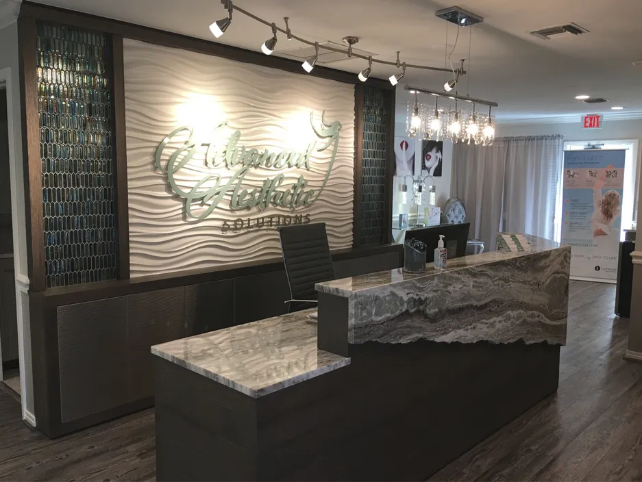 Clean, professional medical spa treatment room with neutral tones at Advanced Aesthetic Solutions in Fort Myers